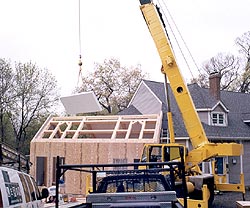 Timber framing - stress skin insulated panels clad the exterior