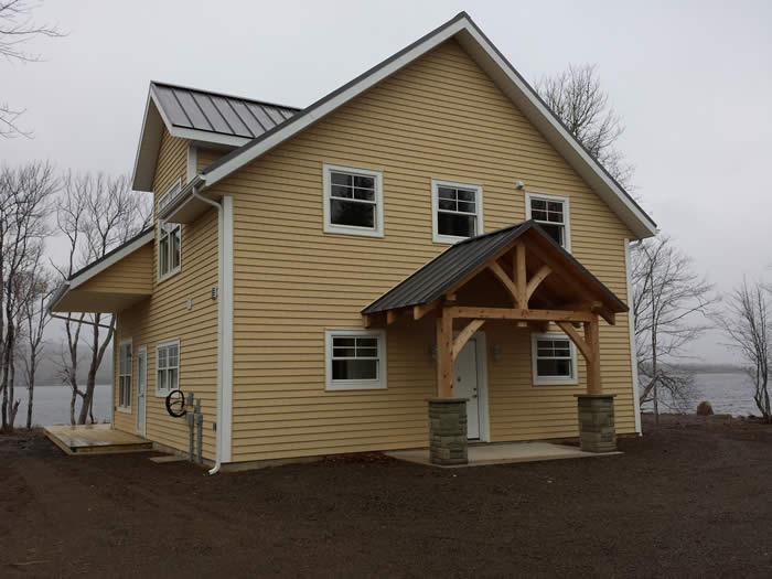 Completed Spruce Timber Frame with Cedar Timber Frame Entry