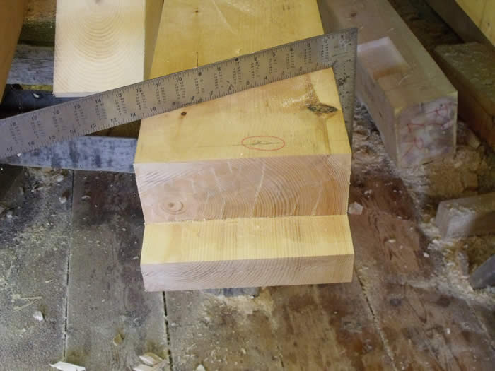Cutting pine timbers in the shop